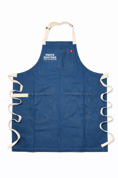 Blue Jean apron with white straps on a white background