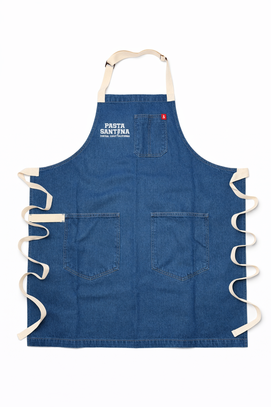 Blue Jean apron with white straps on a white background