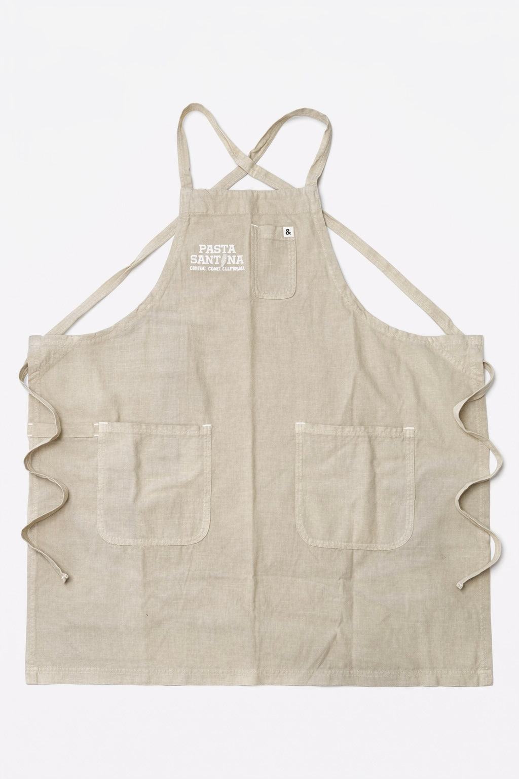 Beige crossback apron with a logo on a white background