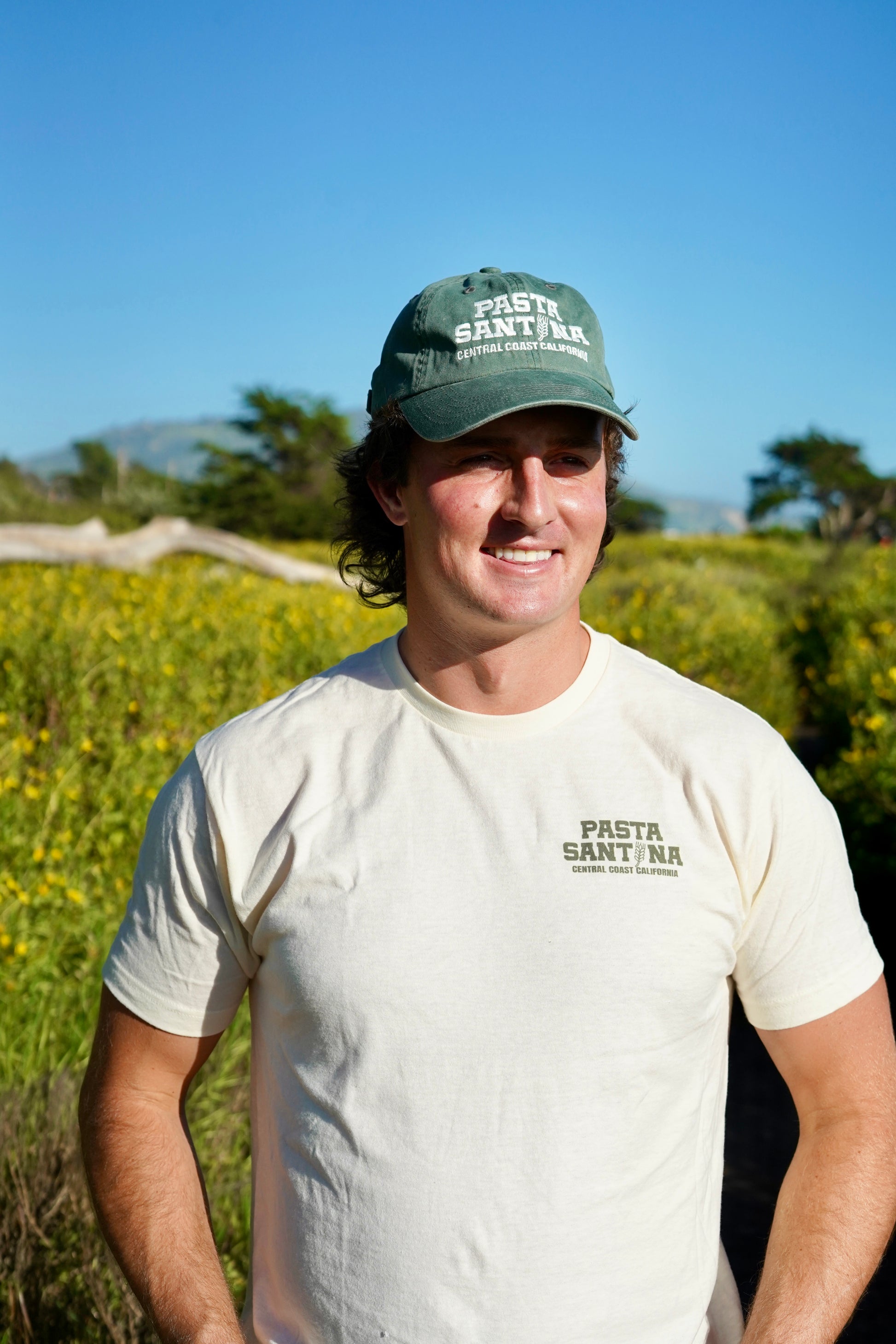 photo model wearing Green colored baseball cap with a brown strap