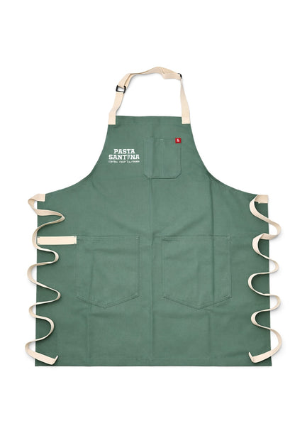 Julep Green apron with white straps on a white background