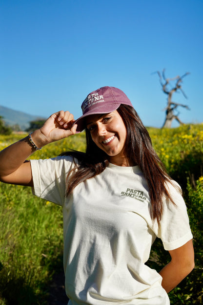 photo of model wearing Marron Colored baseball cap with a brown strap