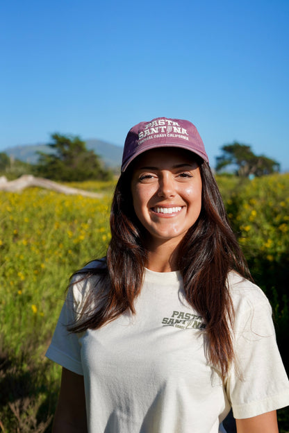 photo of model wearing Marron Colored baseball cap with a brown strap