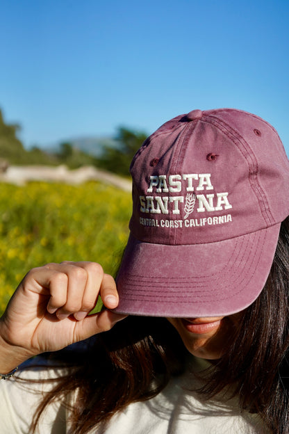 photo of model wearing Marron Colored baseball cap with a brown strap