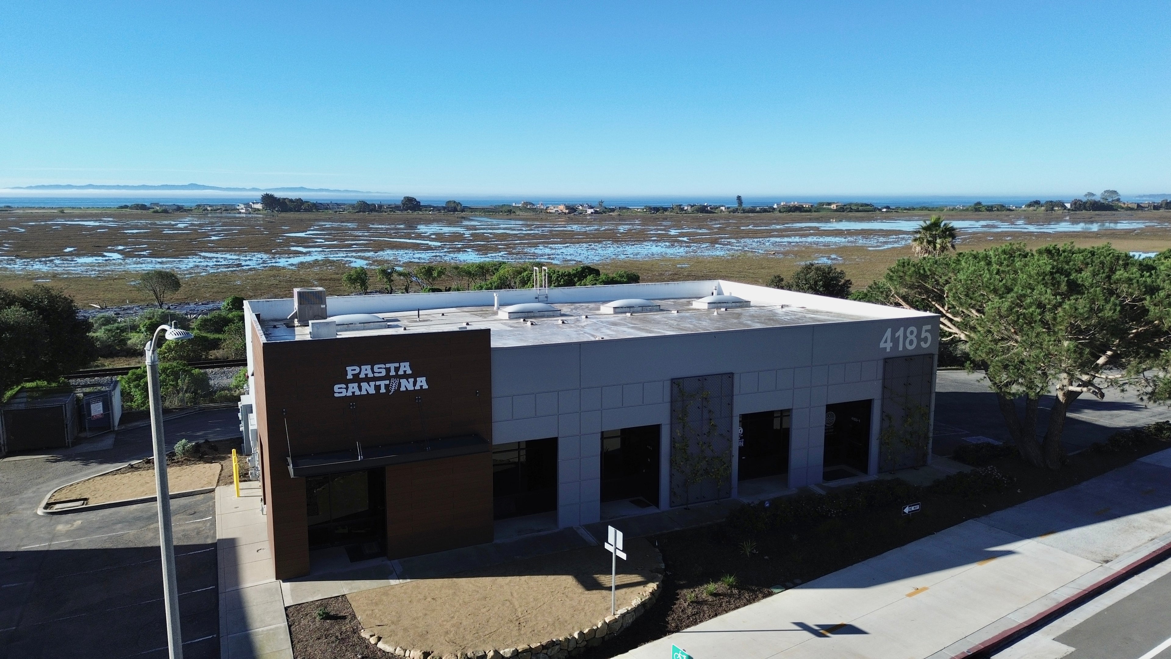 Building with 'Pasta Santina' sign on a clear day