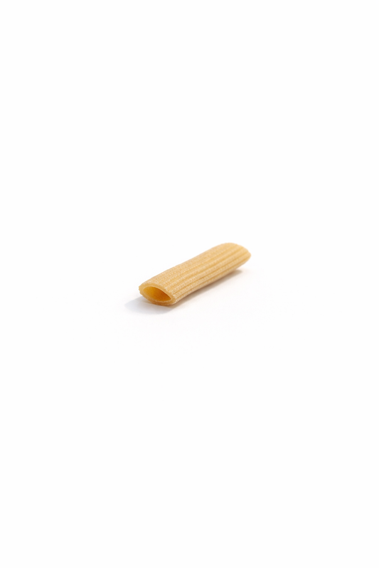 Single piece of pasta on a white background, Penne