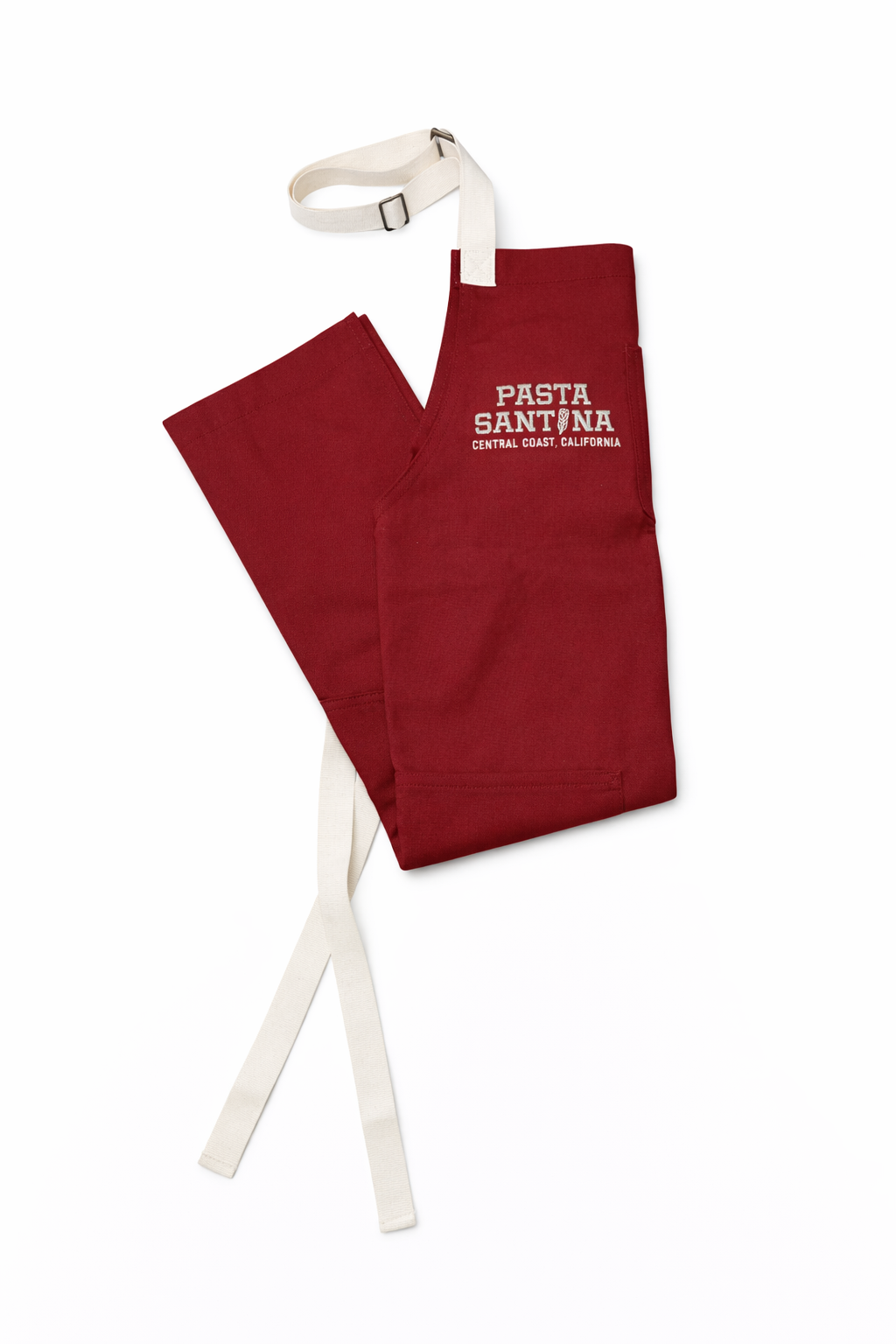 Red apron with white straps on a white background, Folded