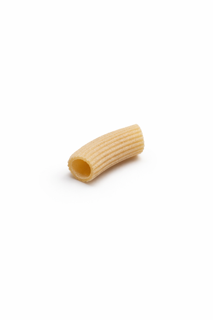 Single piece of pasta on a white background, Rigatoni