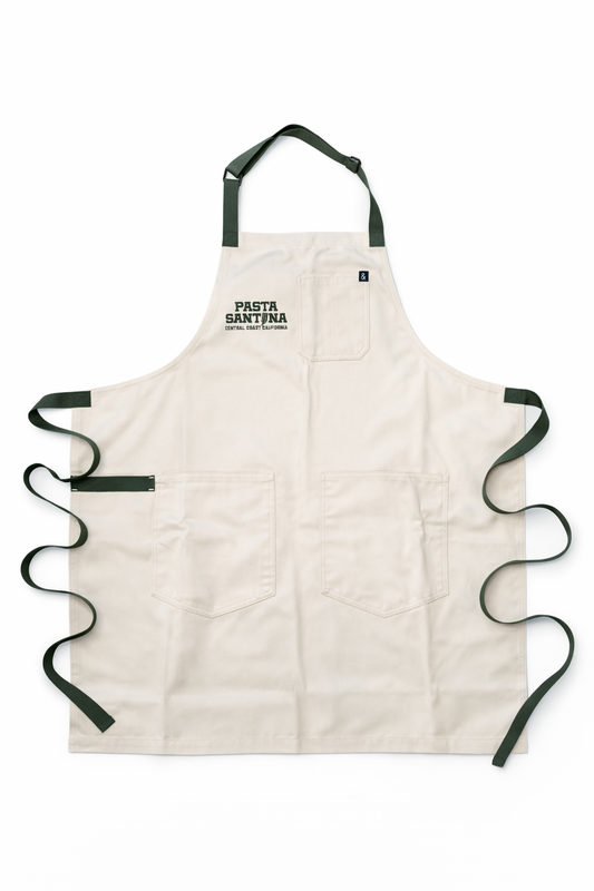 Sand apron with green straps on a white background