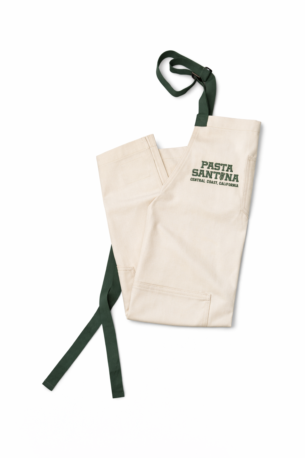 Sand Colored apron with green straps on a white background, Folded